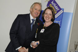 Gerry Pack presents Anne Marie Cottee of Monarch with the runner up award for best cabin crew