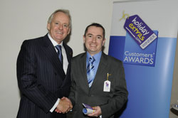 Gerry Pack presents Ian Smith of Liverpool John Lennon Airport with the award for best airport